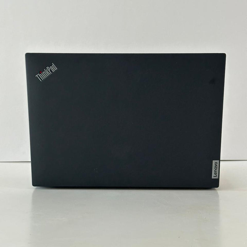 Black laptop on a white surface with a white background