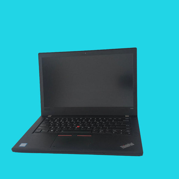 Black lenovo thinkpad laptop on a white surface with a white wall background
