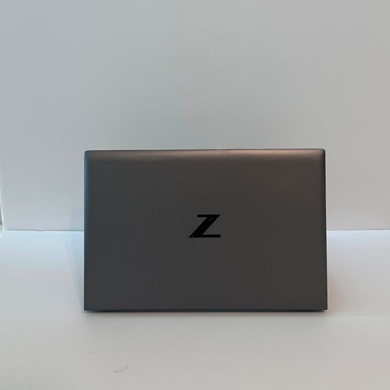 An open black HP laptop on a plain white background, displaying a medical monitoring software interface on the screen.